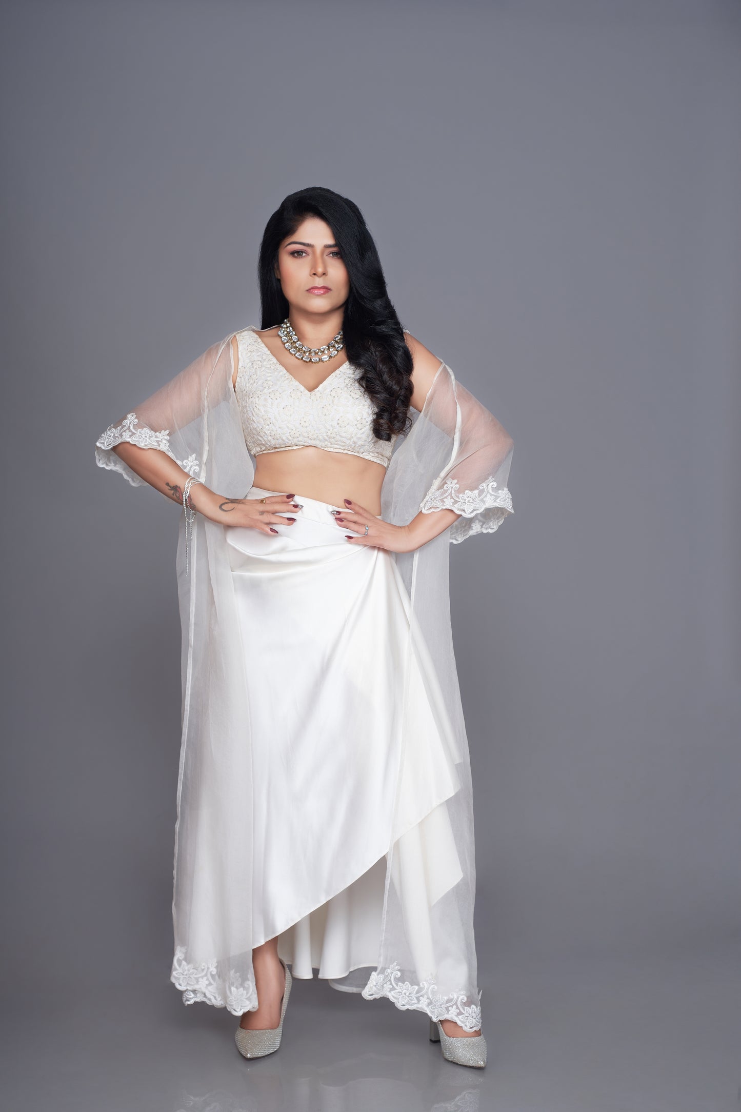 white satin hand embroidered fabric with organza draped skirt cape set
