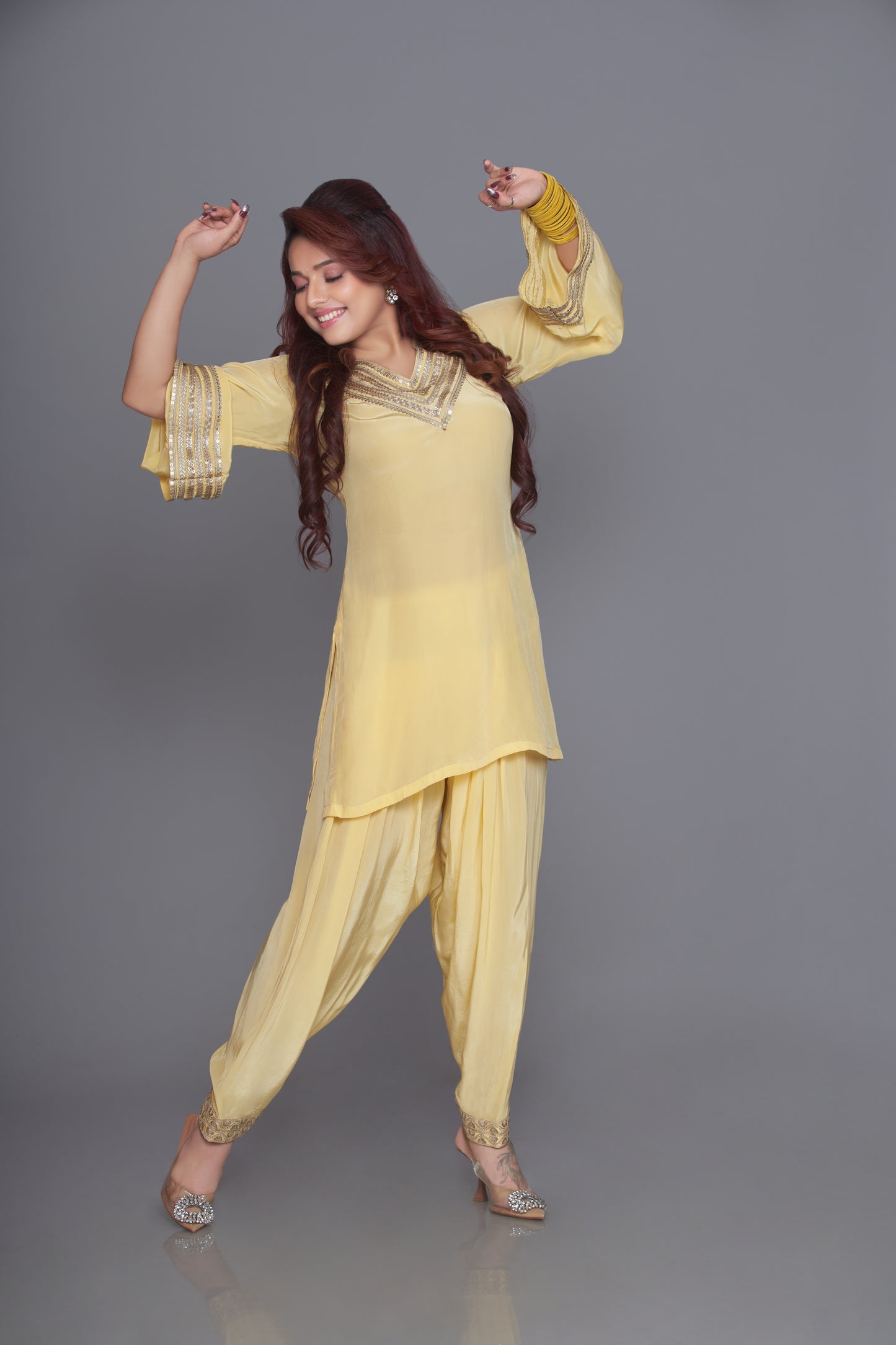 yellow pakistani suit with zari work