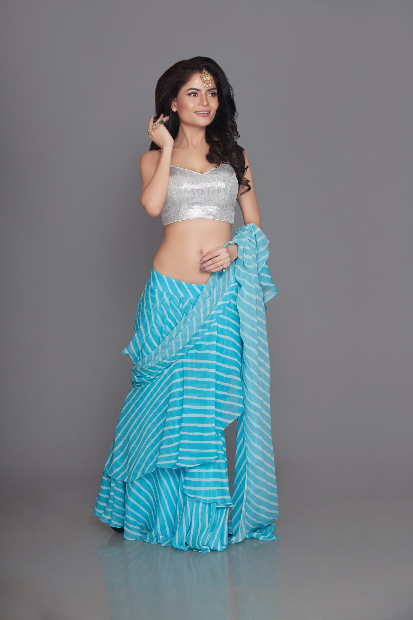 light firozi ruffle saree with sequin blouse set