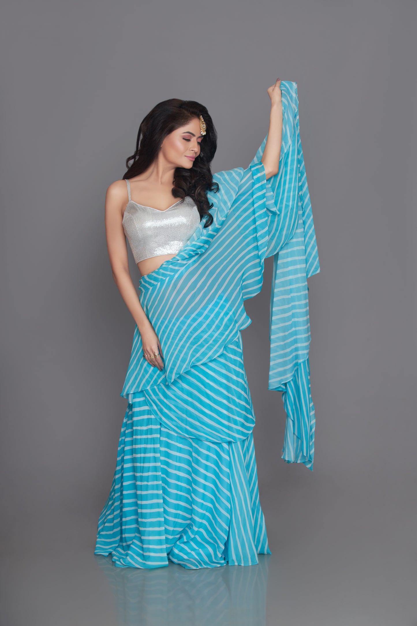 light firozi ruffle saree with sequin blouse set
